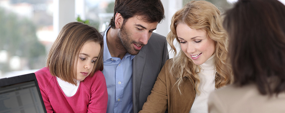Family meeting with insurance agent for an insurance review.