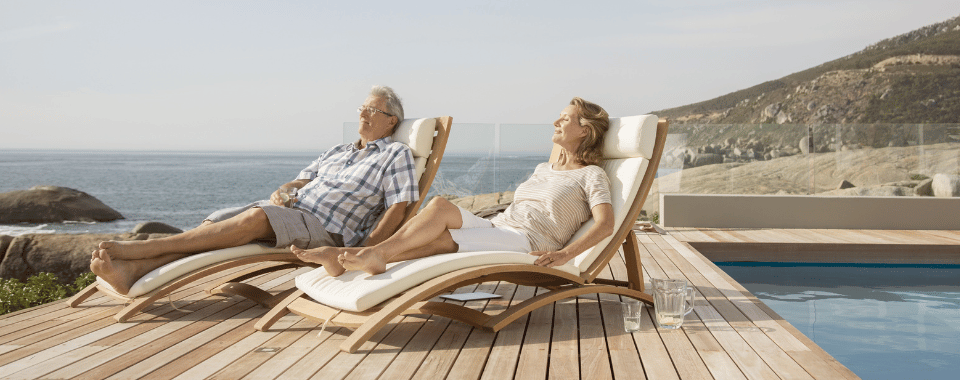 Couple lounging by water